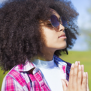 teen girl praying outside